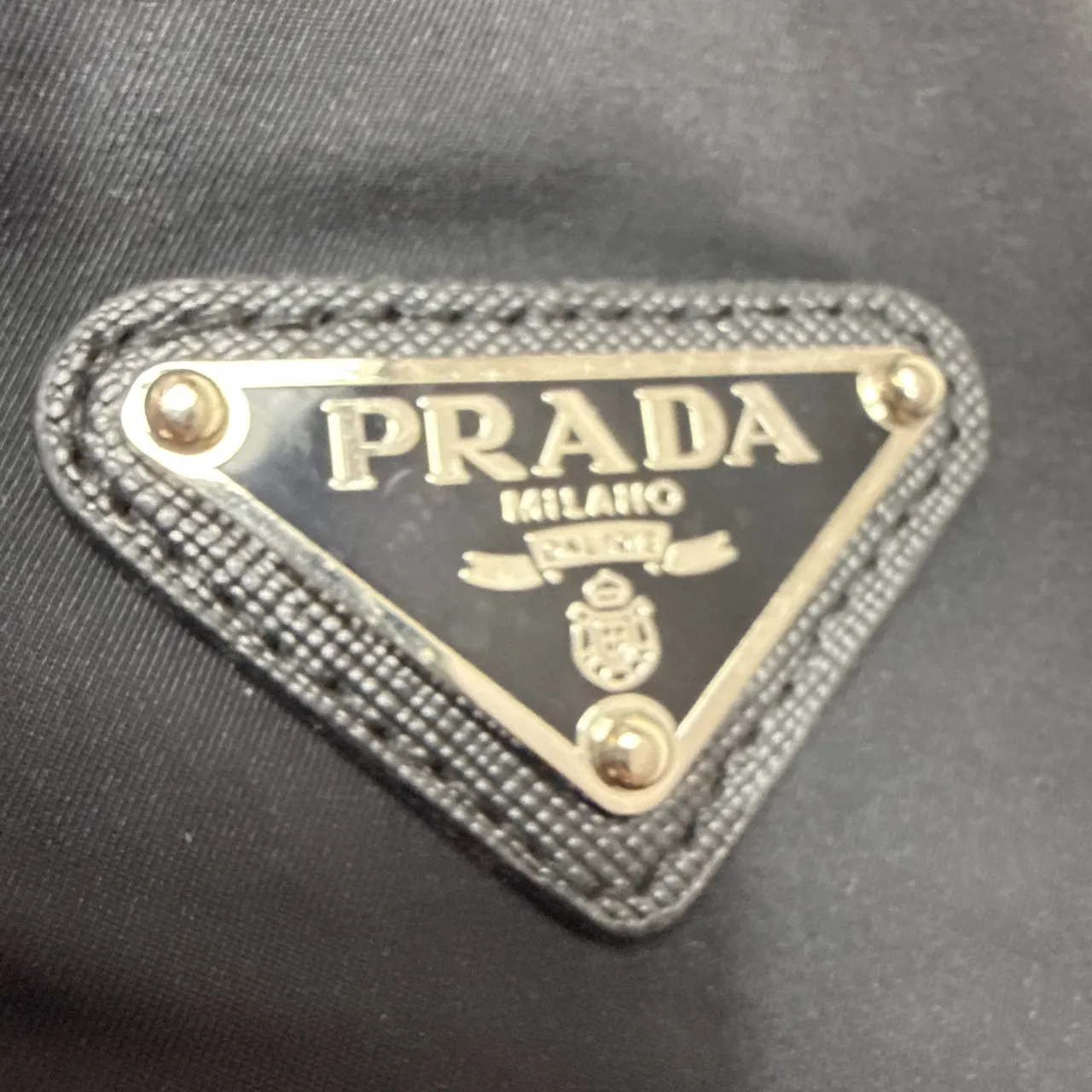 プラダPRADAのファー付きロングダウンコート